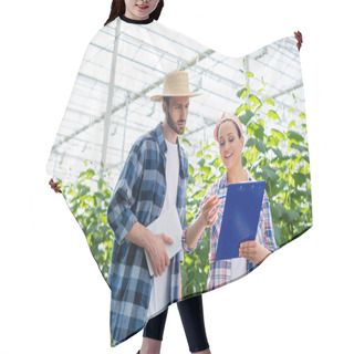 Personality  Smiling African American Farmer Pointing At Clipboard Near Colleague With Digital Tablet  Hair Cutting Cape