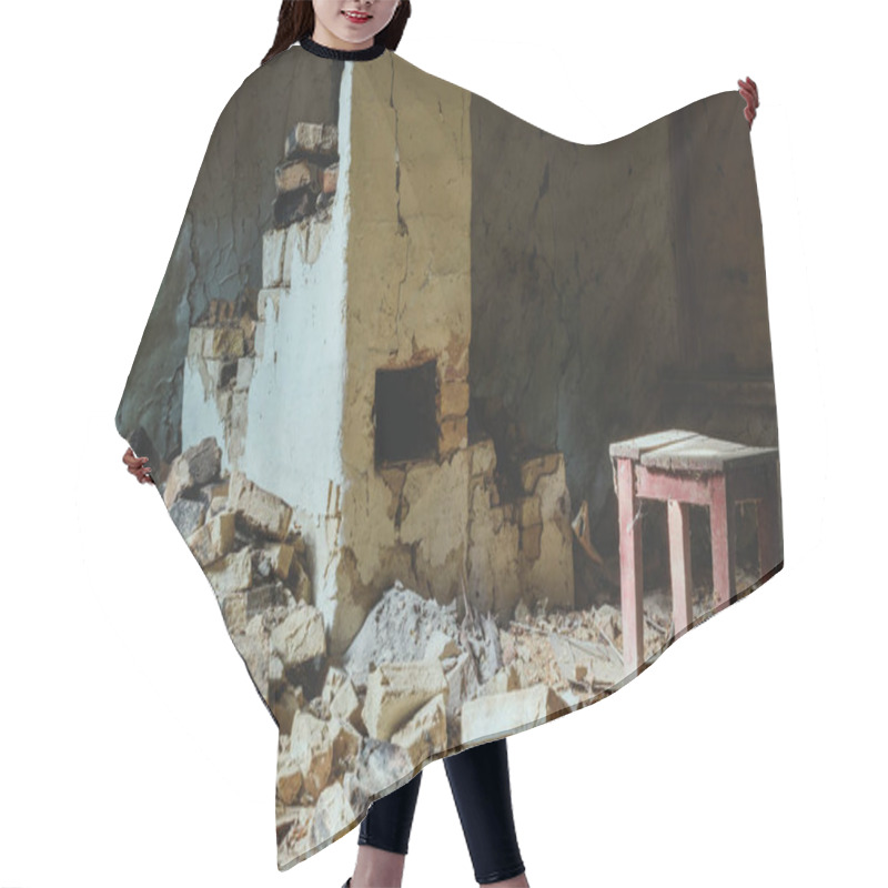 Personality  abandoned building with broken brick wall and wooden chair with dust hair cutting cape