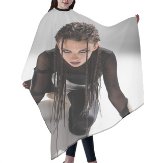 Personality  Futuristic Style Woman With Dreadlocks Posing In Black Tight Jumpsuit On Grey Background Hair Cutting Cape