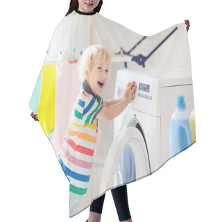 Personality  Child In Laundry Room With Washing Machine Or Tumble Dryer. Kid Helping With Family Chores. Modern Household Devices And Washing Detergent In White Sunny Home. Clean Washed Clothes On Drying Rack.  Hair Cutting Cape