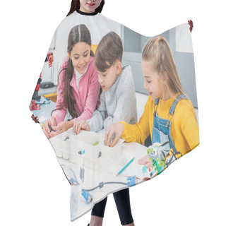 Personality  Preteen Schoolchildren Making Robot With Details In Stem Education Class Hair Cutting Cape