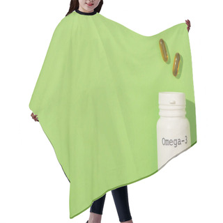 Personality  Top View Of Container With Omega-3 Lettering Near Capsules On Green Hair Cutting Cape