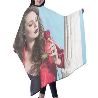 Personality  Attractive Girl Looking At Red Rose Isolated On Blue, Valentines Day Concept   Hair Cutting Cape