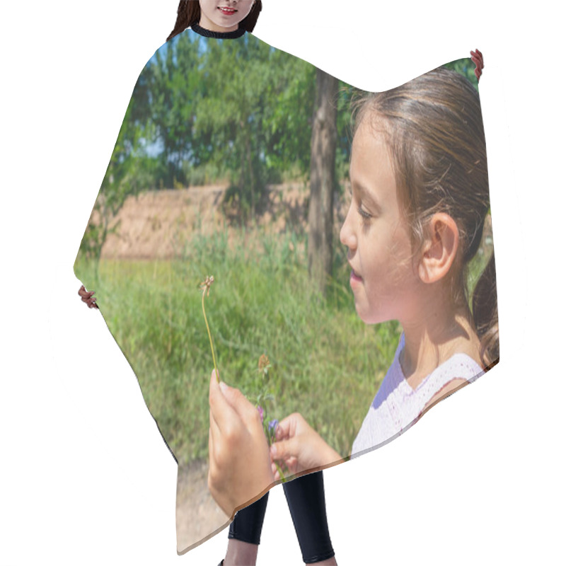 Personality  Pretty Little Girl With A Mask To Protect Herself From The Coronavirus Picking A Flower On A Path Surrounded By Nature. Healthy Life Concept Hair Cutting Cape