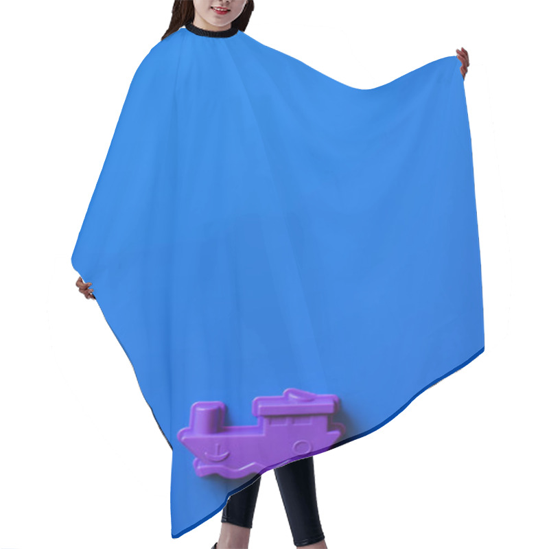 Personality  Top View Of Purple Toy Ship On Blue Background With Copy Space Hair Cutting Cape