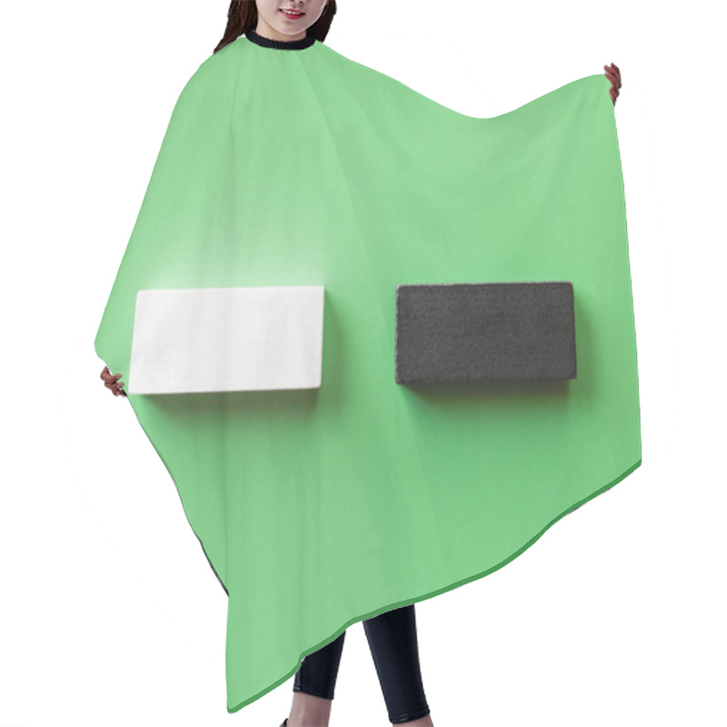 Personality  Top View Of Two White And Black Blocks On Green Background Hair Cutting Cape