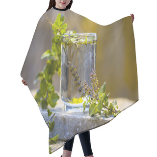 Personality  Water Of Holy Basil, Tulsi Or Ocimum Tenuiflorum In A Transparent Glass. Hair Cutting Cape
