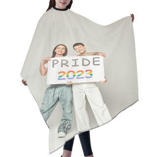 Personality  Happy Lgbt Friends Holding Pride 2023 Placard And Looking At Camera While Celebrating Lgbtq Community Holiday In June On Grey Background In Studio  Hair Cutting Cape
