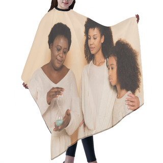 Personality  African American Grandmother Holding Sandglass With Daughter And Granddaughter Standing Nearby On Beige Background Hair Cutting Cape