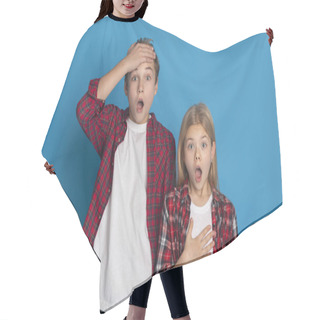 Personality  Shocked Brother And Sister Standing With Opened Mouth Over Blue Background Hair Cutting Cape
