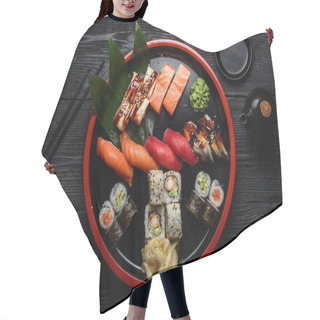 Personality  Japanese Cuisine. Sushi Set On A Round Plate Over Dark Wooden Background. Hair Cutting Cape