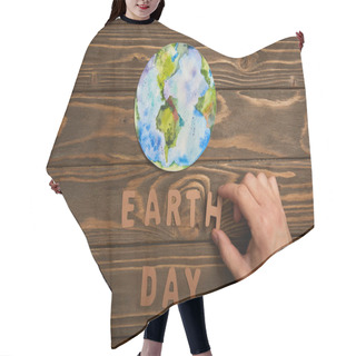 Personality  Partial View Of Woman Holding Paper Letters And Planet Picture On Brown Wooden Background, Earth Day Concept Hair Cutting Cape
