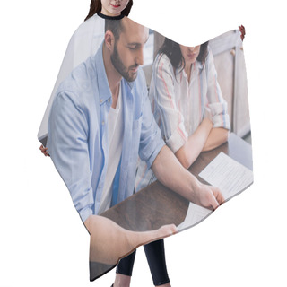 Personality  High Angle View Of Man Reading Document With Foreclosure And Final Notice Lettering Near Woman With Crossed Arms At Table Hair Cutting Cape