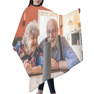 Personality  Excited Senior Couple Using A Virtual Assistant At Home Hair Cutting Cape