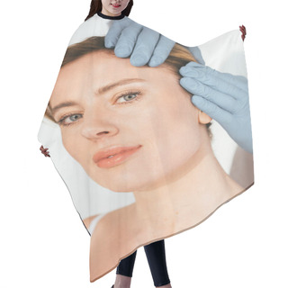 Personality  Cropped View Of Dermatologist In Latex Gloves Examining Hair Of Attractive Patient On White   Hair Cutting Cape
