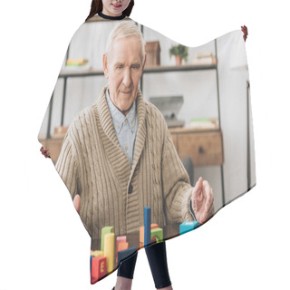 Personality  Senior Man Playing With Wooden Toys On Table Hair Cutting Cape