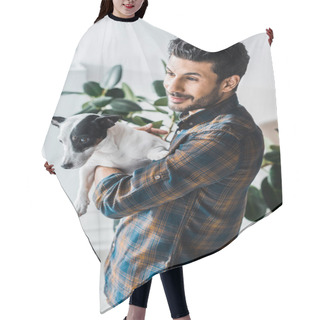 Personality  Smiling Bi-racial Man Holding Jack Russell Terrier And Looking Through Window  Hair Cutting Cape