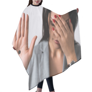 Personality  Selective Focus Of Sad Businesswoman Showing Hand With Black Dot On Palm And Covering Eyes Isolated On White, Domestic Violence Concept  Hair Cutting Cape