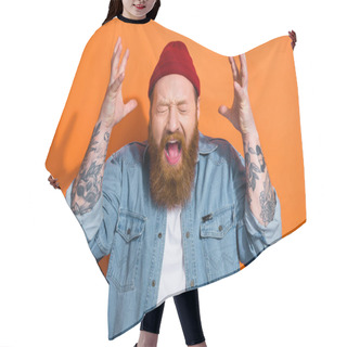Personality  Photo Of Unsatisfied Negative Person Closed Eyes Open Mouth Scream Raise Arms Isolated On Orange Color Background. Hair Cutting Cape