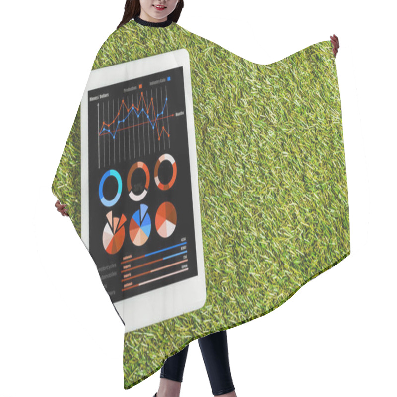 Personality  Top View Of Digital Tablet With Charts And Graphs On Screen On Green Grass, Energy Efficiency Concept Hair Cutting Cape