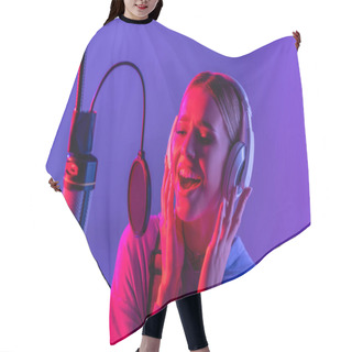 Personality  Young Singer In Wireless Headphones Recording Song While Singing In Microphone On Purple  Hair Cutting Cape