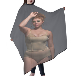 Personality  Young Plus Size Model With Curvy Body In Beige Underwear Standing With Hand Near Head On Dark Grey Hair Cutting Cape
