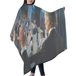 Personality  Back View Of Politician Or Activist Pronouncing Speech During Press Campaign In The Conference Hall. Mature Organization Representative Answers Questions, Gives Interview To Journalists For Media. Hair Cutting Cape