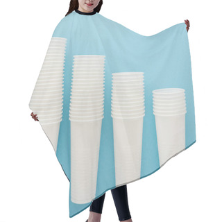 Personality  Flat Lay With White Plastic Cups On Blue Background With Copy Space  Hair Cutting Cape