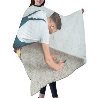Personality  Installer In Overalls Holding Cutter Near Carpet  Hair Cutting Cape