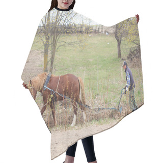 Personality  A Man Plows The Ground With A Plow Under His Horse Hair Cutting Cape