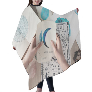 Personality  Top View Of Astrologer Holding Watercolor Paintings With Moon Phases On Cards By Birth Chart On Table Hair Cutting Cape