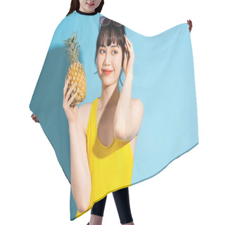 Personality  Beautiful Asian Woman Wearing Yellow Jumpsuit On Blue Background And Eating Tropical Fruits, Summer Concept Hair Cutting Cape
