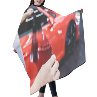 Personality  Applying Tinting Foil On A Car Window In A Auto Service Hair Cutting Cape