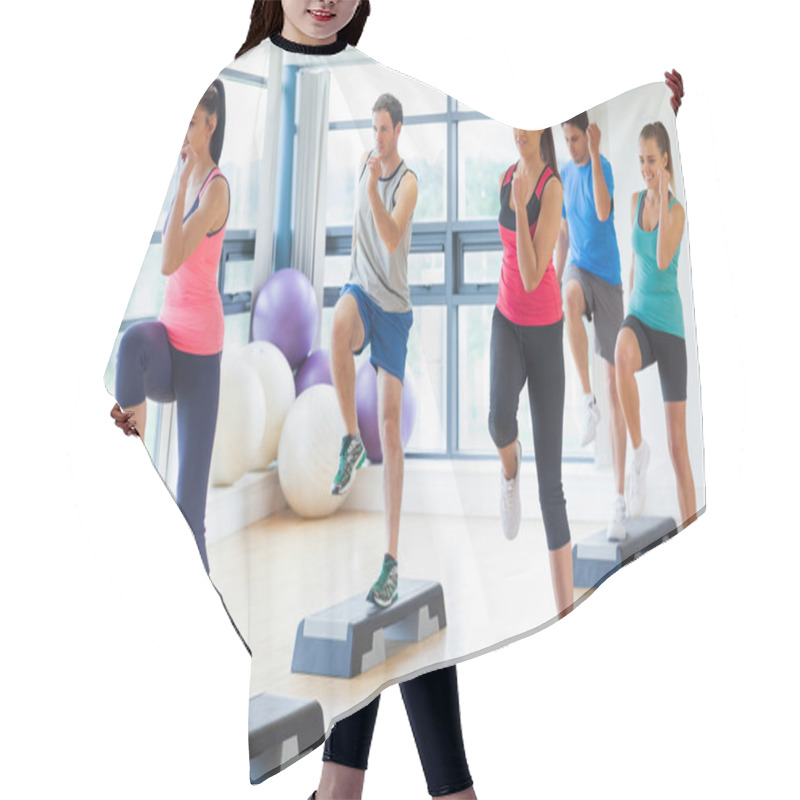 Personality  Instructor With Fitness Class Performing Step Aerobics Exercise Hair Cutting Cape