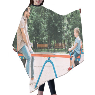 Personality  Side View Of Father And Son Having Fun On Swing At Playground In Park Hair Cutting Cape
