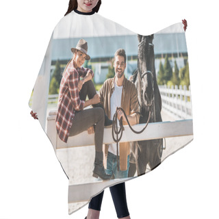 Personality  Smiling Female Equestrian Sitting On Fence, Colleague Standing Near Fence With Horse At Ranch Hair Cutting Cape