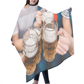 Personality  Close-up Partial View Of Young Friends Holding Glasses Of Beer In Hands Hair Cutting Cape
