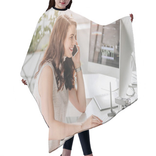 Personality  Side View Of Cheerful Editor Talking On Smartphone Near Computer Monitor  Hair Cutting Cape