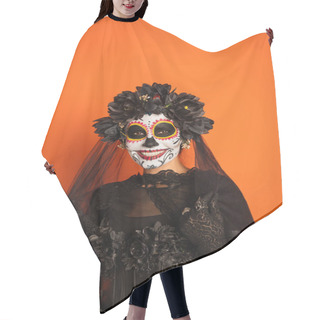 Personality  Happy Woman In Traditional Day Of Dead Makeup Touching Black Veil And Looking At Camera Isolated On Orange Hair Cutting Cape