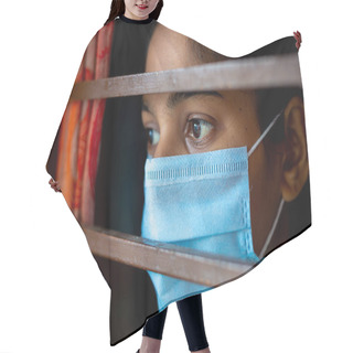 Personality  A Bored Asian Young Girl Wearing A Protection Surgical Face Mask At Looking Through Window Being In-home Quarantine During Coronavirus Outbreak. Close-up Views. Hair Cutting Cape