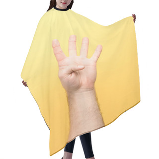 Personality  Cropped View Of Man Showing Four Fingers On Yellow Background  Hair Cutting Cape