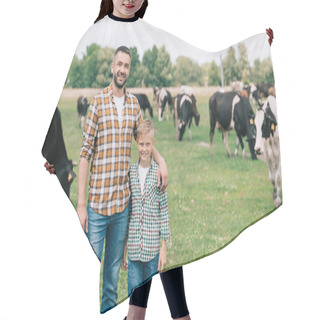 Personality  Father And Son Smiling At Camera While Standing Near Grazing Cattle At Farm  Hair Cutting Cape