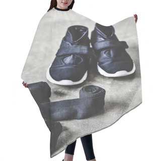 Personality  Close-up Shot Of Sneakers And Wrist Wraps On Concrete Floor Hair Cutting Cape