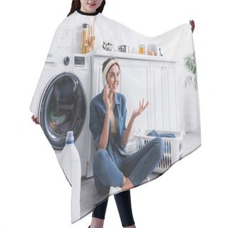 Personality  Smiling Housewife Talking On Smartphone Near Detergent And Washing Machine In Kitchen  Hair Cutting Cape