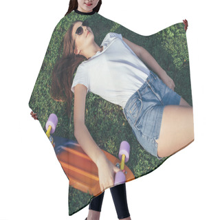 Personality  Teen Girl Resting On Grass With Her Skateboard. Pretty Teenager  Hair Cutting Cape