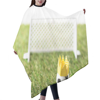 Personality  Selective Focus Of Toy Football Gates And Ball With Paper Crown On Green Grass Isolated On White, Sports Betting Concept Hair Cutting Cape