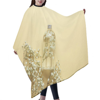 Personality  Top View Of Bottle With Organic Beauty Product Near Dried White Wildflowers On Yellow Background  Hair Cutting Cape