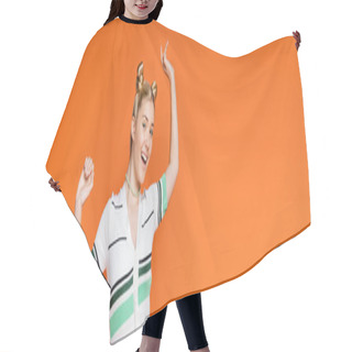 Personality  Excited And Cheerful Blonde Teenager With Hairstyle And Bold Makeup Posing In Casual Clothes And Looking At Camera While Standing Isolated On Orange, Fashionable And Trendy Clothes, Banner  Hair Cutting Cape