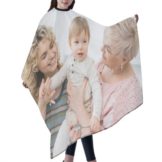 Personality  Joyful Women Looking At Toddler Girl Holding Spoon In Kitchen Hair Cutting Cape