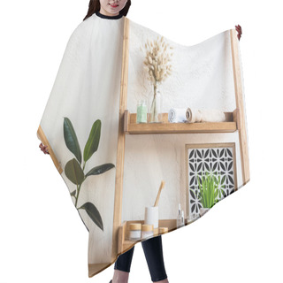 Personality  Wooden Shelves With Blooming Catkins, Towel Rolls, Toothbrushes, Containers And Bottles Near Green Plants In Flowerpots  Hair Cutting Cape